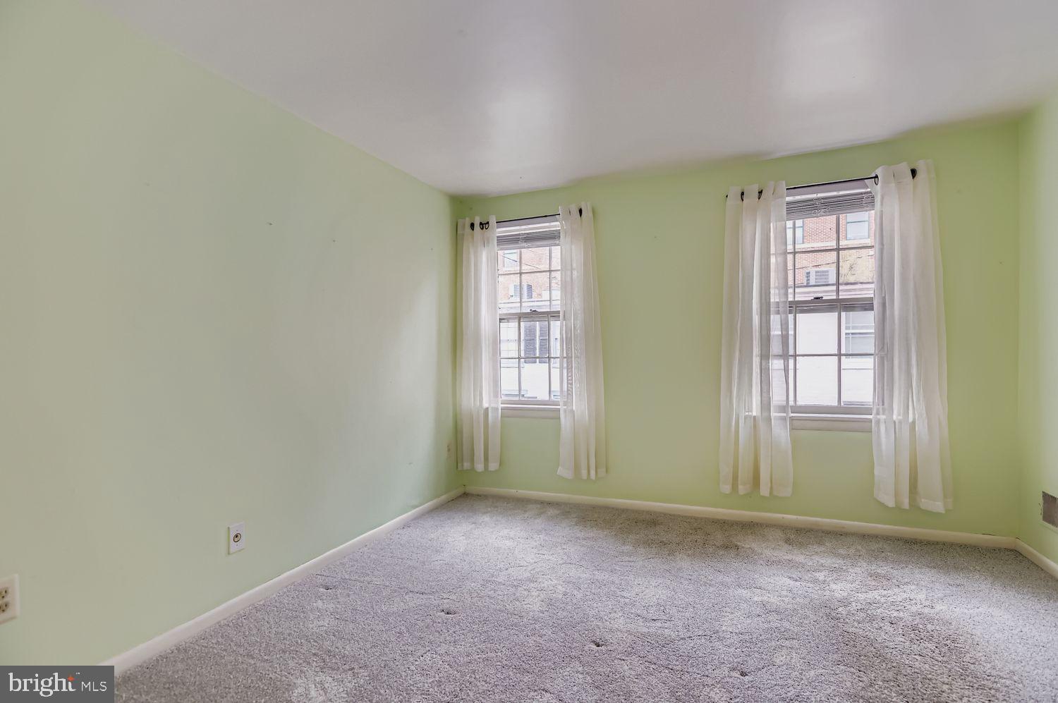 649 Dover Street Baltimore, MD 21230 - Photo 14 of 25 an empty room with windows