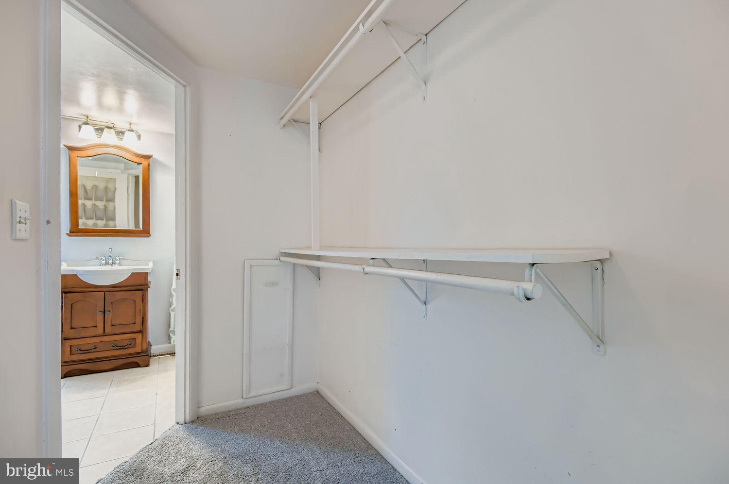 649 Dover Street Baltimore, MD 21230 - Photo 16 of 25 a view of walk in closet with empty racks