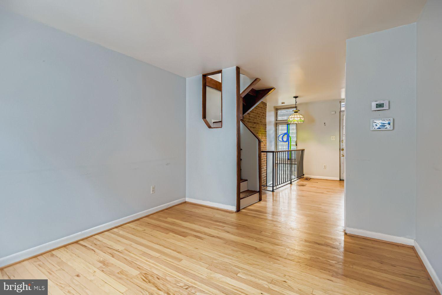649 Dover Street Baltimore, MD 21230 - Photo 2 of 25 a view of empty room with wooden floor