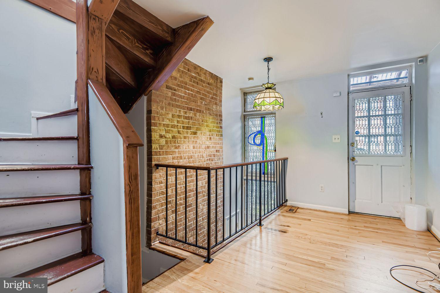 649 Dover Street Baltimore, MD 21230 - Photo 4 of 25 a view of bedroom with wooden floor and window