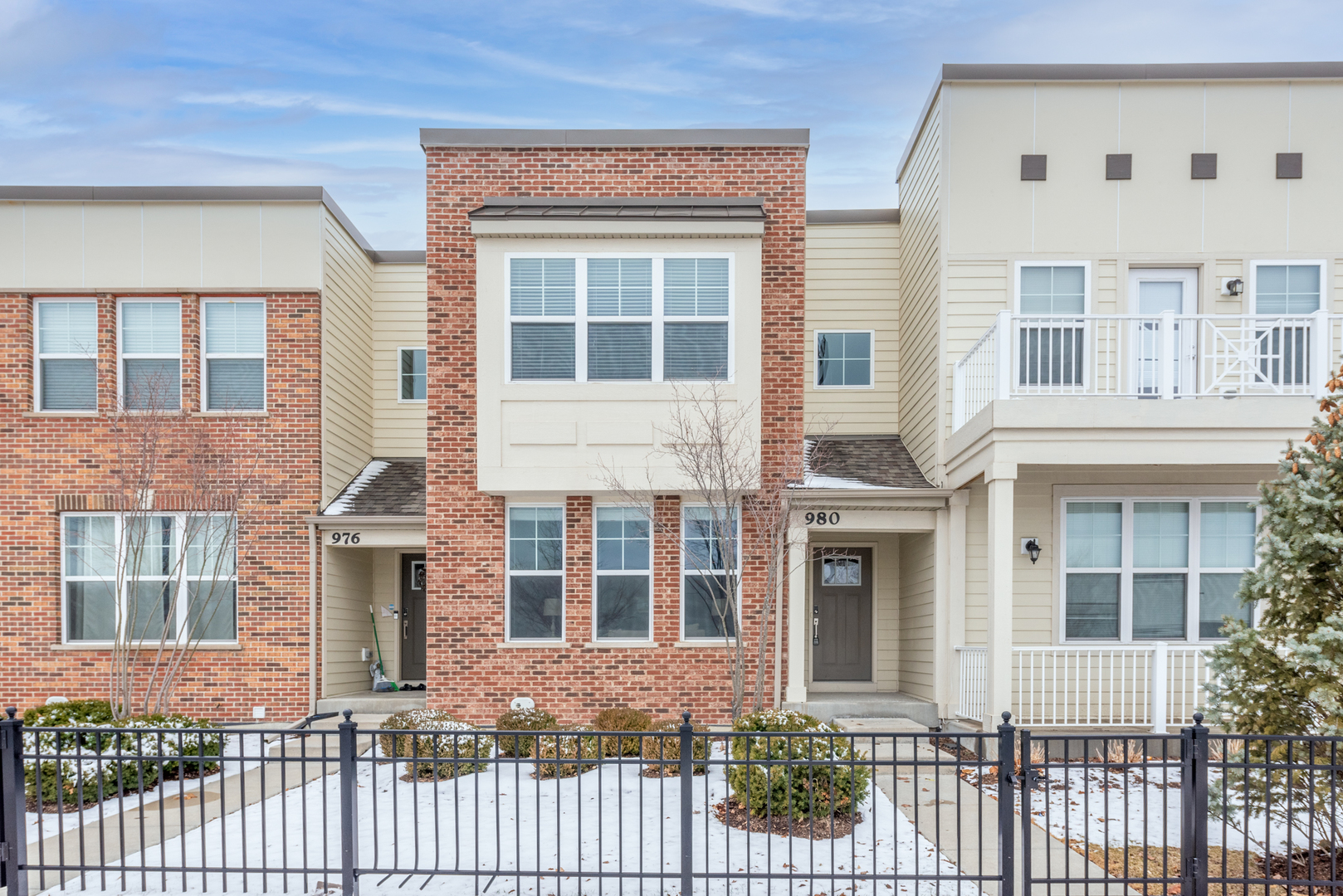 980 Station Boulevard Aurora, IL 60504 - Photo 1 of 27 front view of a brick house with large windows