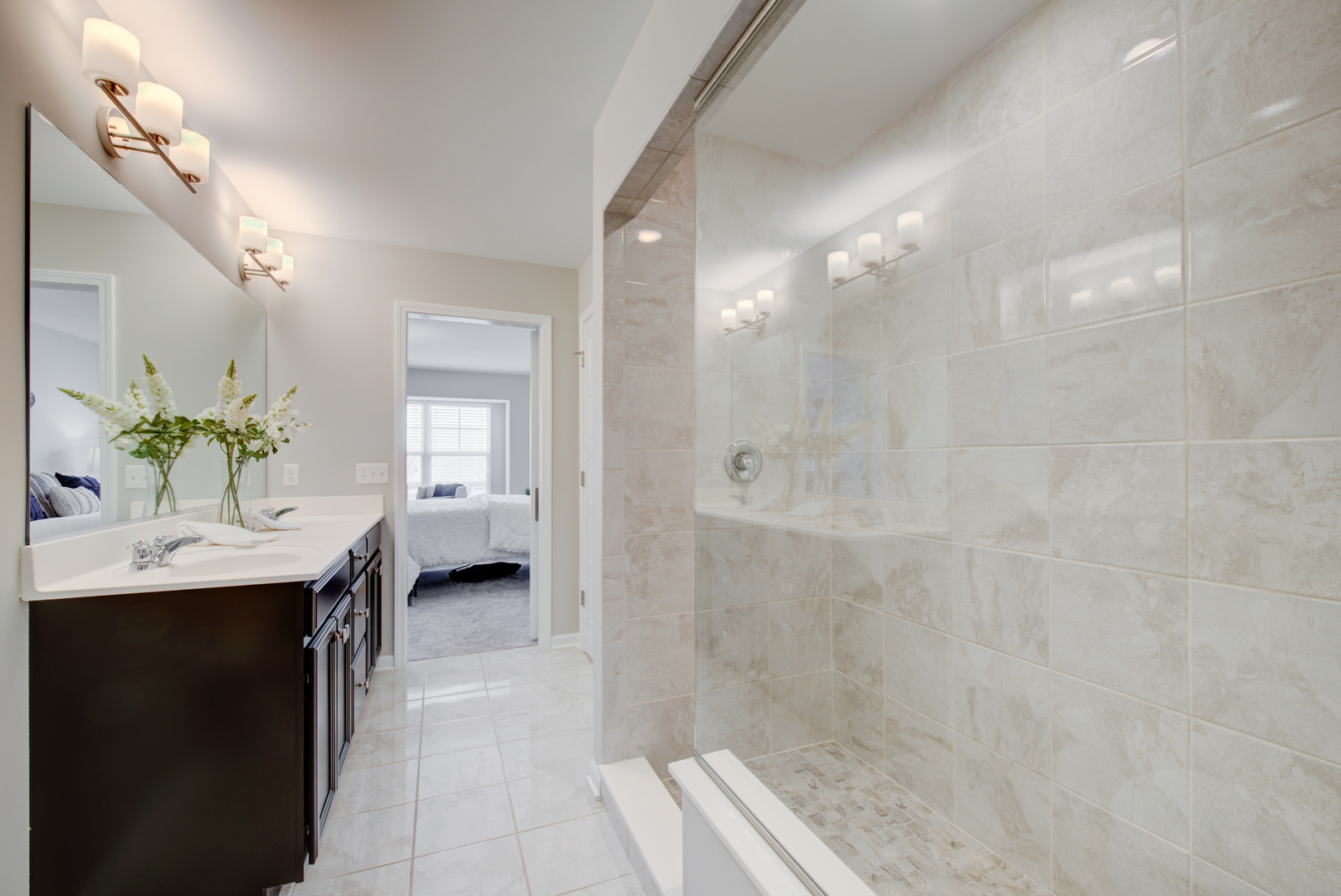 980 Station Boulevard Aurora, IL 60504 - Photo 14 of 27 a bathroom with a granite countertop sink a toilet and shower
