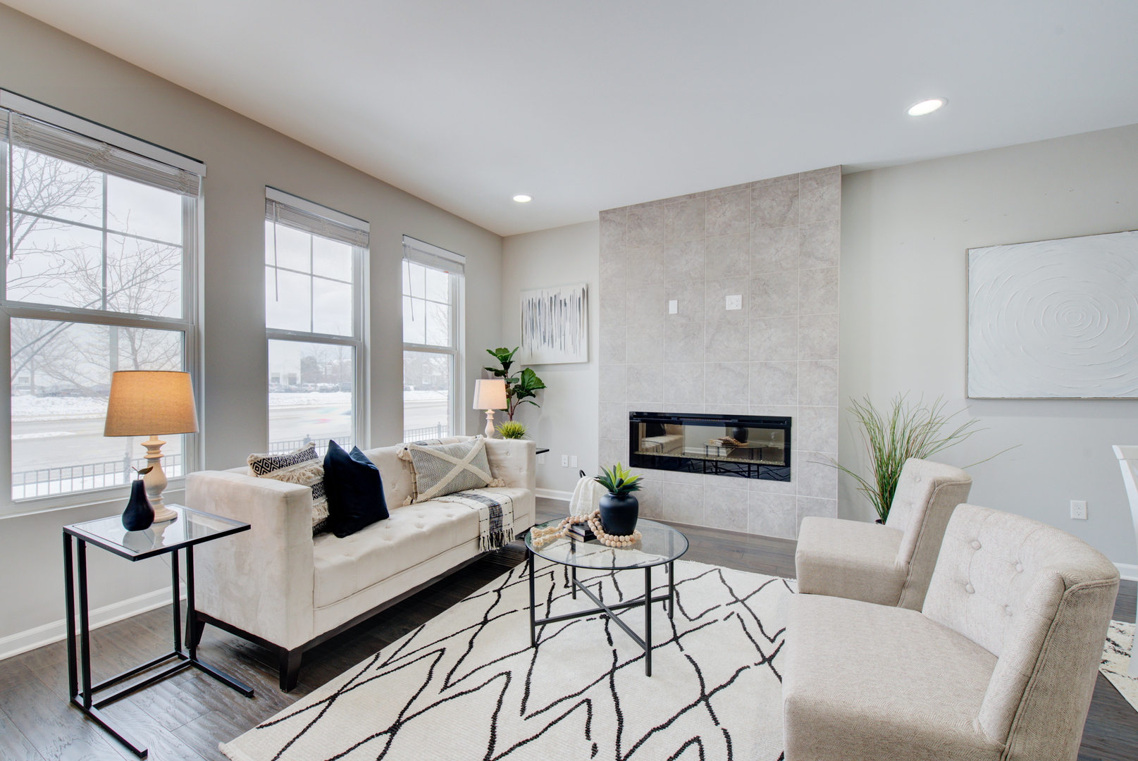 980 Station Boulevard Aurora, IL 60504 - Photo 3 of 27 a living room with furniture and a fireplace