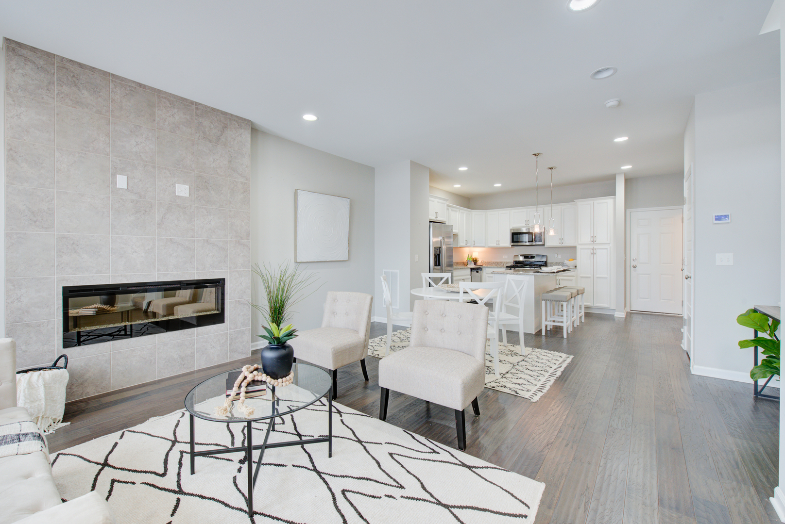 980 Station Boulevard Aurora, IL 60504 - Photo 4 of 27 a living room with furniture and kitchen view