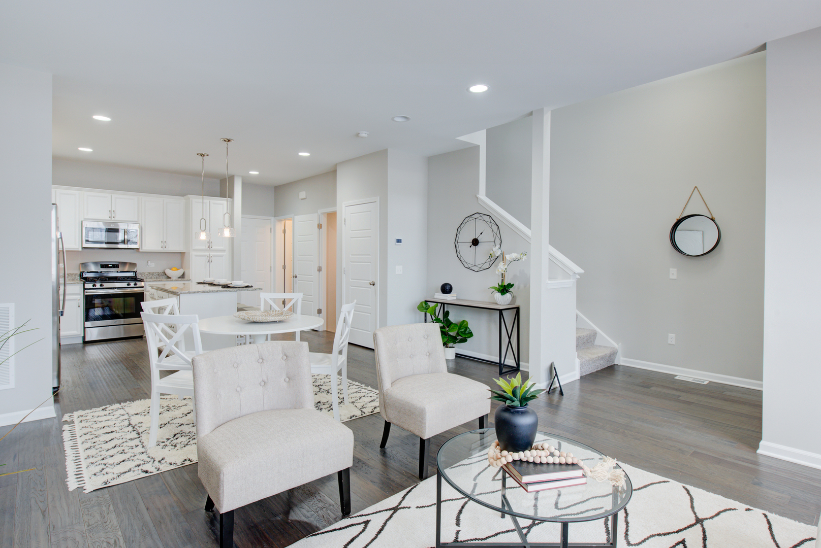980 Station Boulevard Aurora, IL 60504 - Photo 5 of 27 a living room with furniture and kitchen view