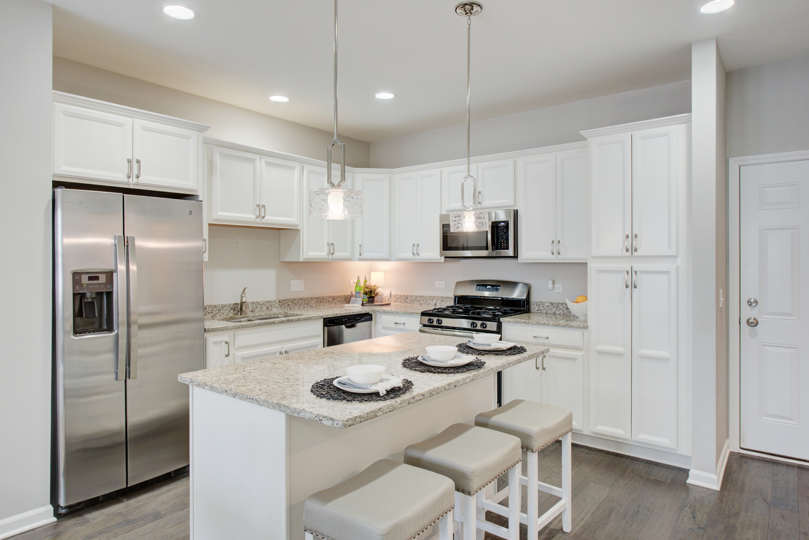 980 Station Boulevard Aurora, IL 60504 - Photo 7 of 27 a kitchen with a refrigerator a stove a sink and a refrigerator