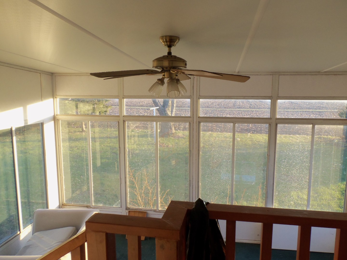 201 West 3rd Street Sublette, IL 61367 - Photo 14 of 16 a room with a balcony a bed and a chandelier