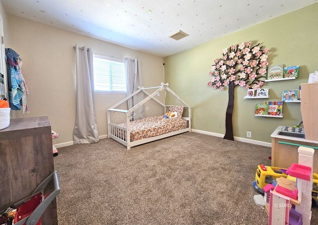 630 South Sunset Street Ridgecrest, CA 93555 - Photo 14 of 34 a view of livingroom with toys
