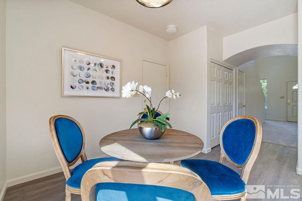 9775 Meadowstar Drive Reno, NV 89506 - Photo 14 of 30 a view of a dining room with furniture and wooden floor