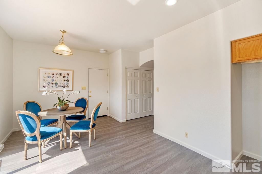 9775 Meadowstar Drive Reno, NV 89506 - Photo 17 of 30 a view of a dining room with furniture and wooden floor