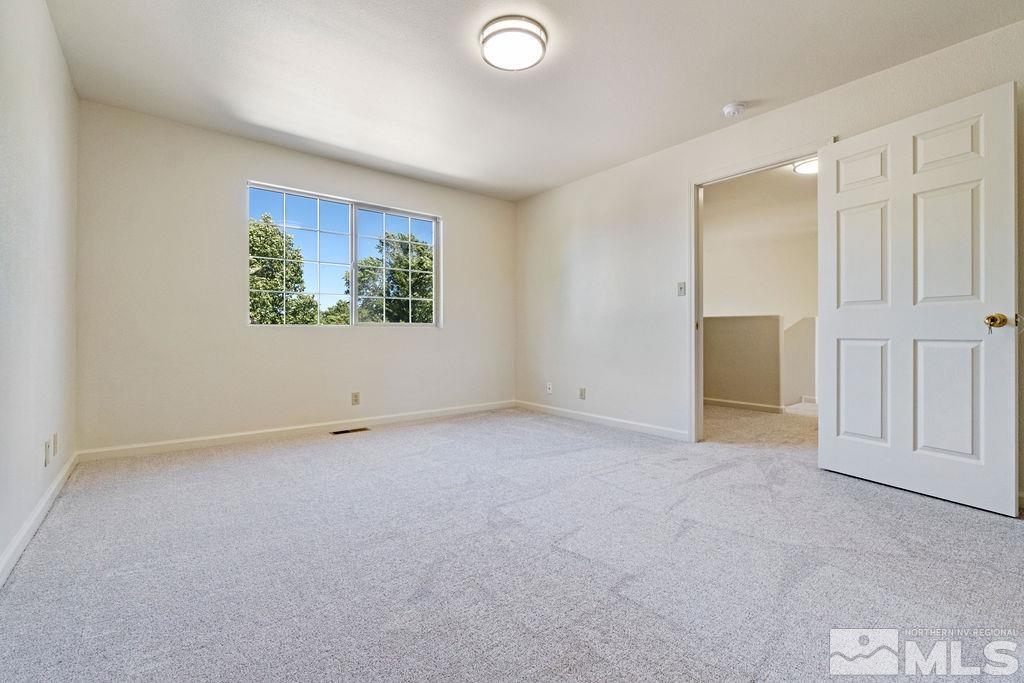 9775 Meadowstar Drive Reno, NV 89506 - Photo 21 of 30 an empty room with windows and closet