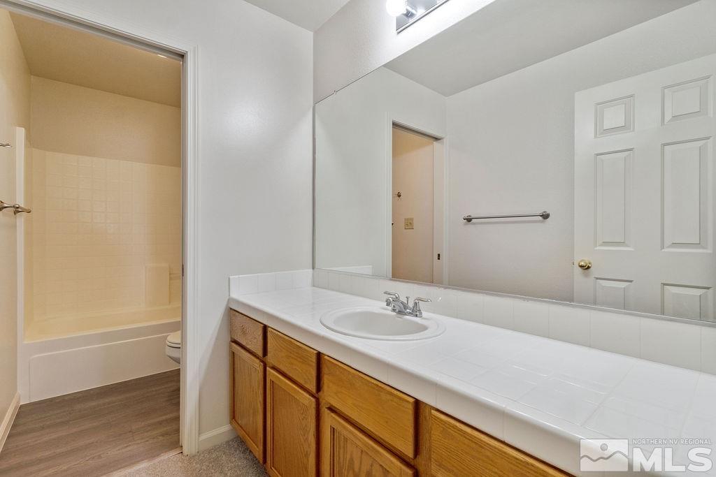 9775 Meadowstar Drive Reno, NV 89506 - Photo 26 of 30 a bathroom with a sink and a mirror