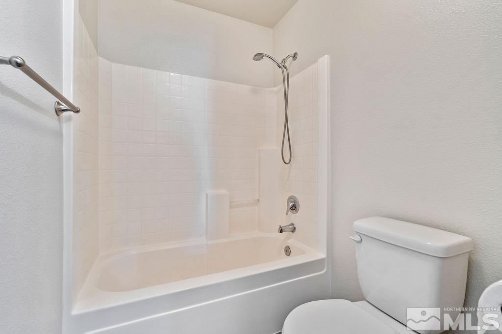 9775 Meadowstar Drive Reno, NV 89506 - Photo 27 of 30 a bathroom with a toilet and a bathtub