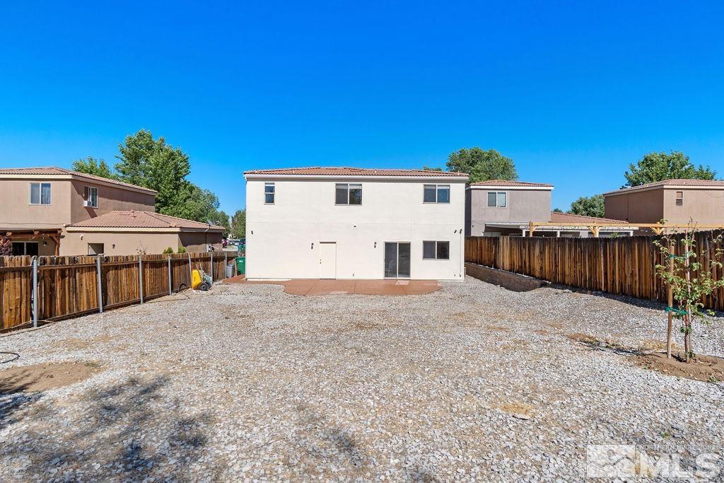 9775 Meadowstar Drive Reno, NV 89506 - Photo 30 of 30 a view of a house with a wooden fence