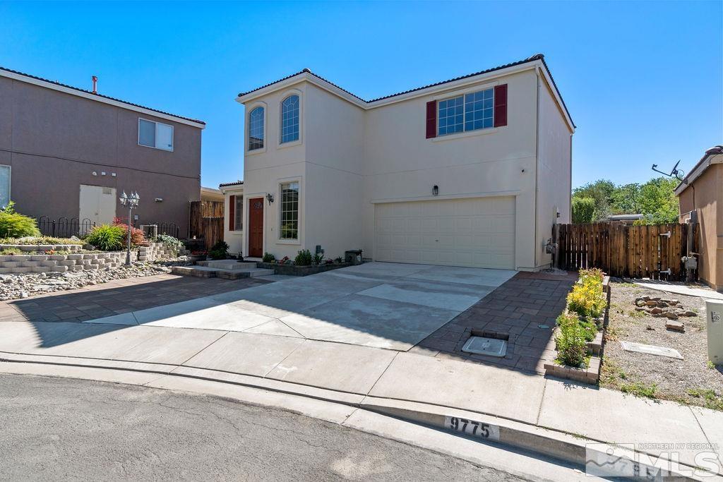 9775 Meadowstar Drive Reno, NV 89506 - Photo 3 of 30 a front view of a house with garden