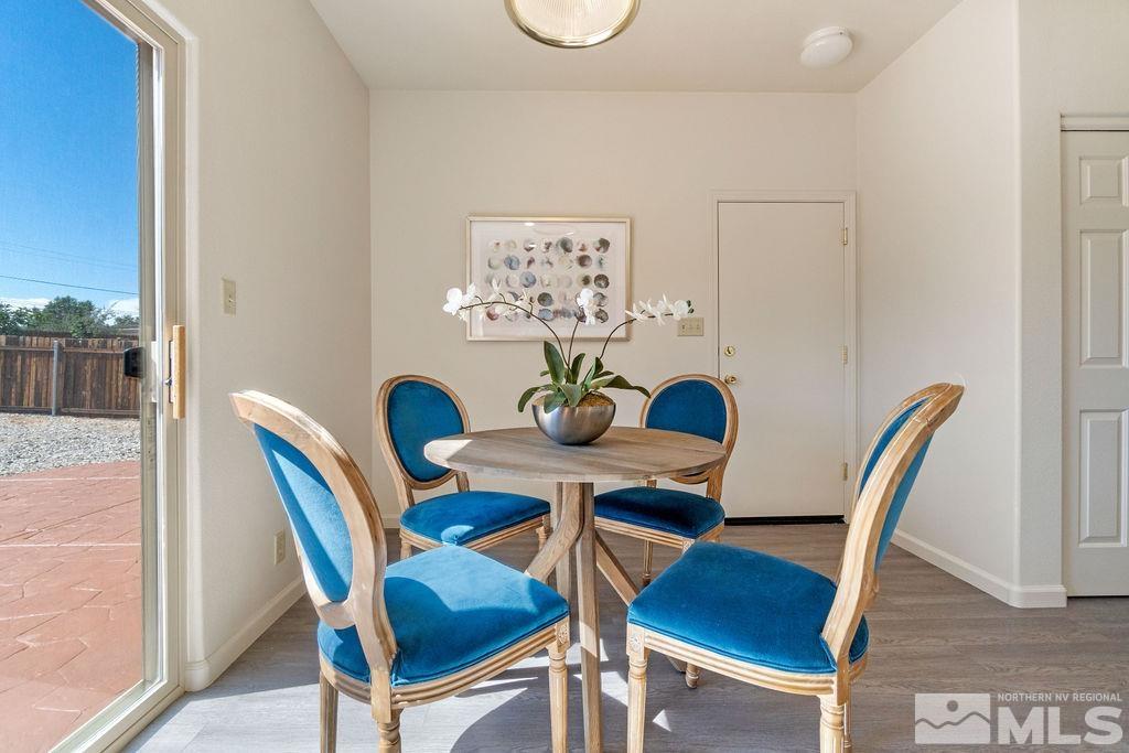 9775 Meadowstar Drive Reno, NV 89506 - Photo 10 of 30 a view of a dining room with furniture and wooden floor