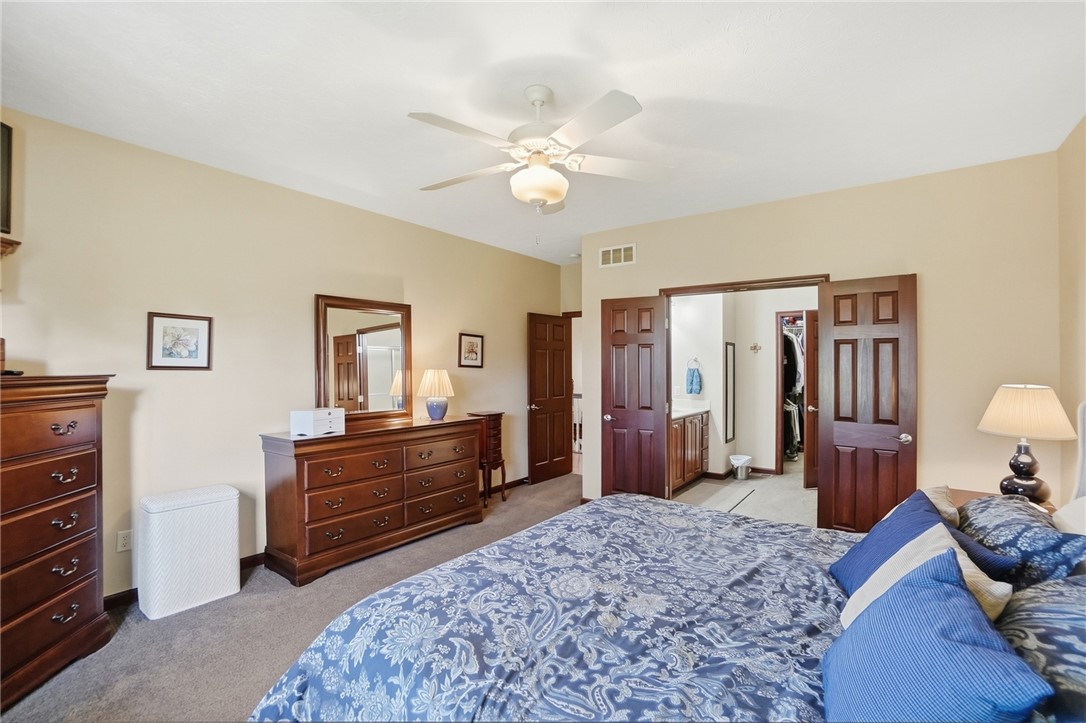710 Governors Road Troy, OH 45373 - Photo 18 of 56 This restful bedroom offers plush carpeting and a convenient en-suite bathroom access.