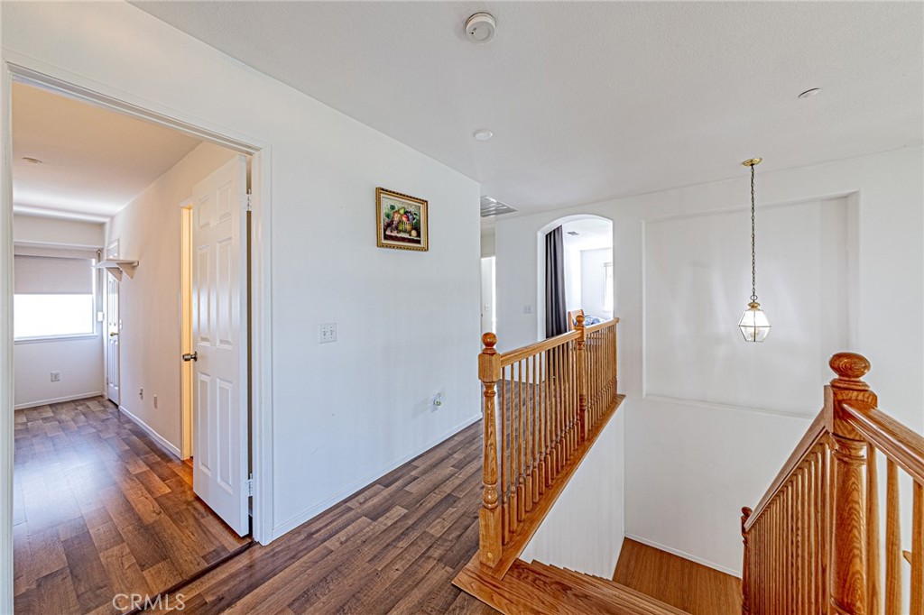 5423 Canmore Court Riverside, CA 92507 - Photo 19 of 58 a view of a hallway with wooden floor and stairs