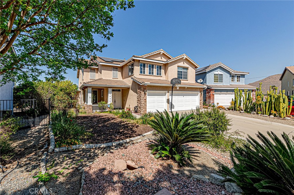 5423 Canmore Court Riverside, CA 92507 - Photo 44 of 58 a front view of a house with a garden
