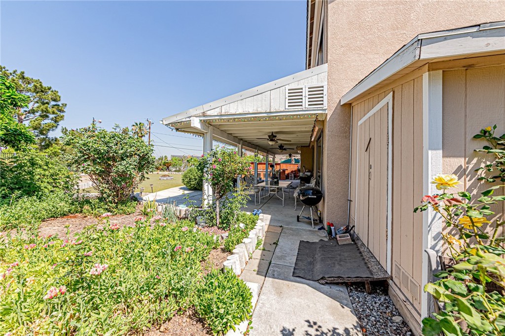 5423 Canmore Court Riverside, CA 92507 - Photo 49 of 58 a view of a patio with table and chairs potted plants