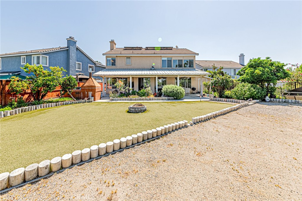 5423 Canmore Court Riverside, CA 92507 - Photo 51 of 58 a front view of a building with a garden