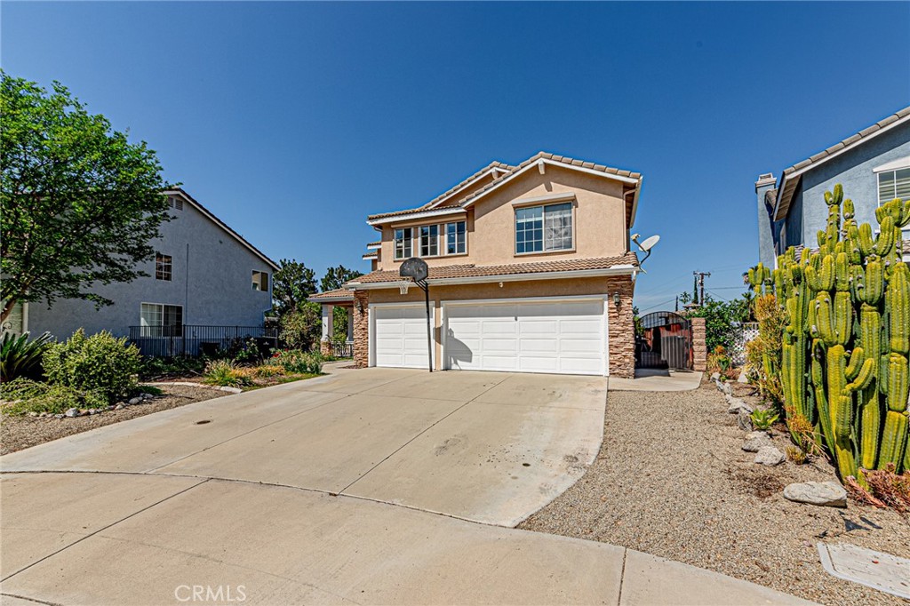 5423 Canmore Court Riverside, CA 92507 - Photo 53 of 58 a front view of a house with a yard and garage
