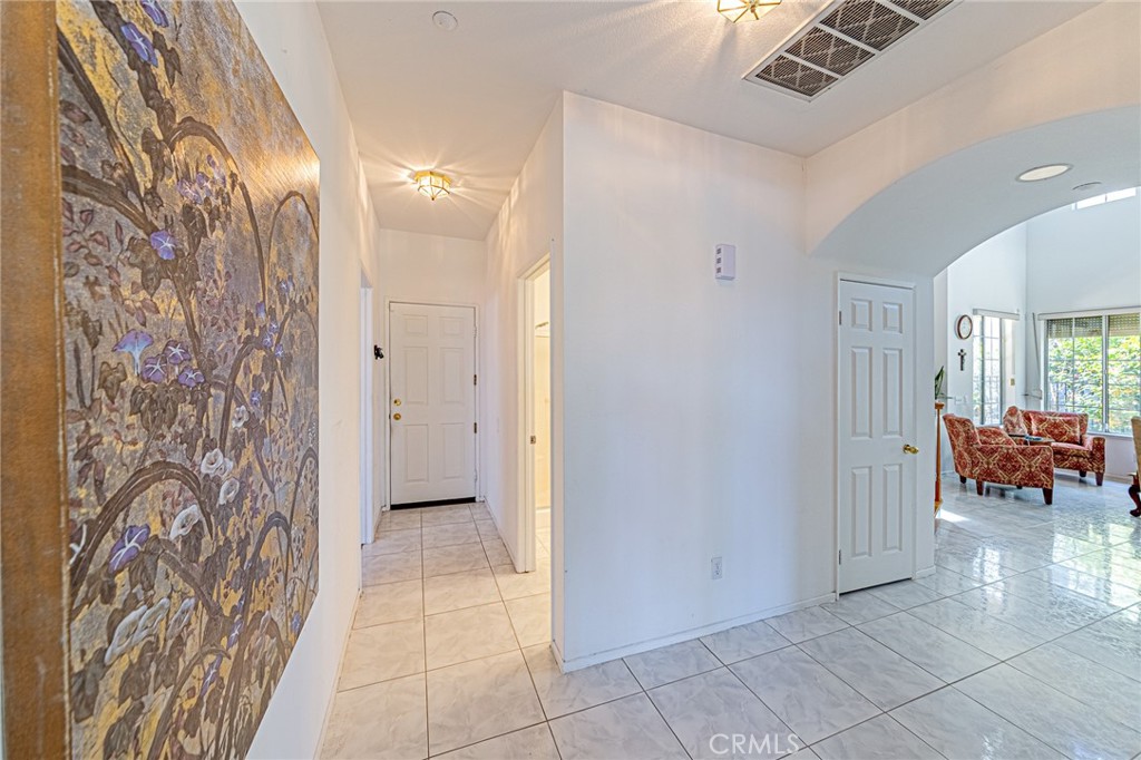 5423 Canmore Court Riverside, CA 92507 - Photo 6 of 58 a view of a hallway and a livingroom with furniture