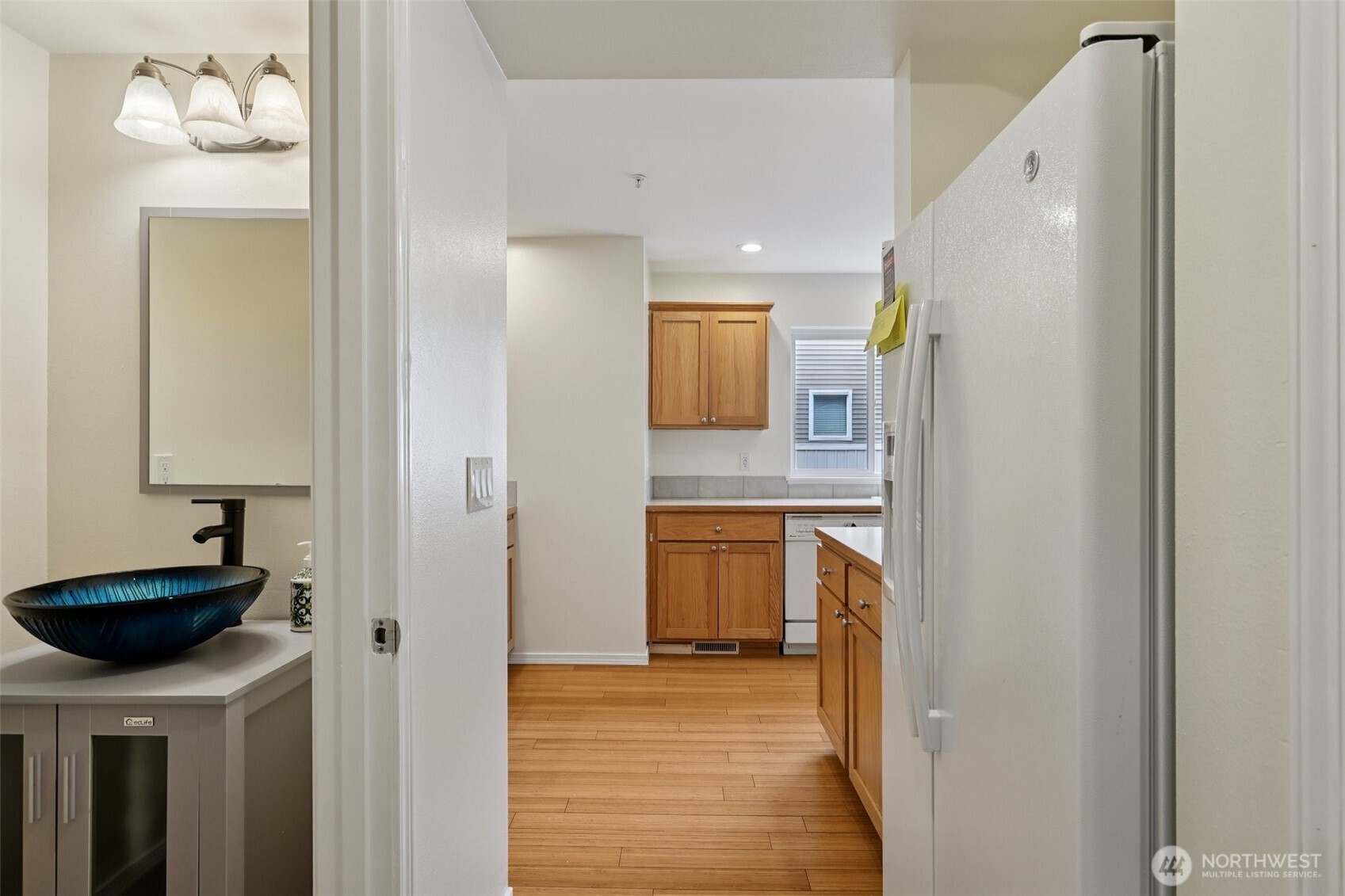 5502 240th Street Southwest, Unit C304 Mountlake Terrace, WA 98043 - Photo 13 of 30 a view of a kitchen from the hallway