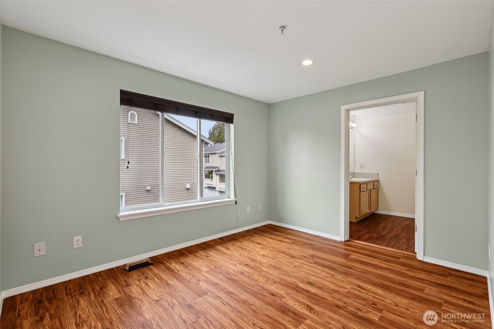 5502 240th Street Southwest, Unit C304 Mountlake Terrace, WA 98043 - Photo 20 of 30 an empty room with wooden floor and windows