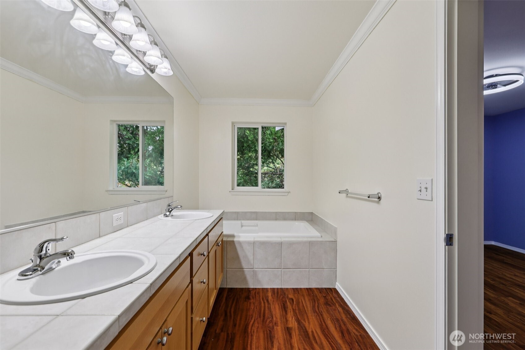 5502 240th Street Southwest, Unit C304 Mountlake Terrace, WA 98043 - Photo 23 of 30 a bathroom with a sink a mirror and a window