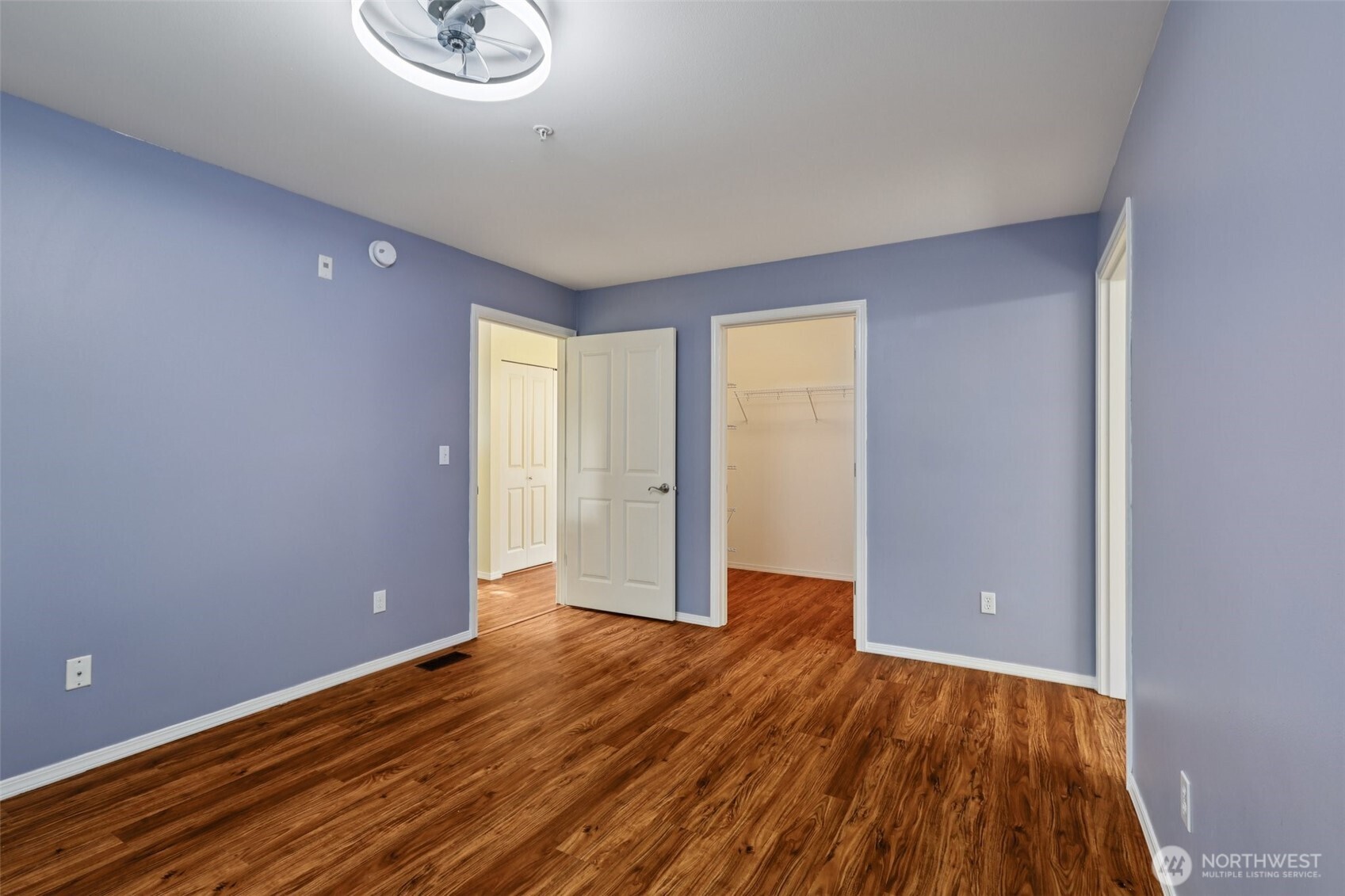 5502 240th Street Southwest, Unit C304 Mountlake Terrace, WA 98043 - Photo 27 of 30 wooden floor in an empty room with a window
