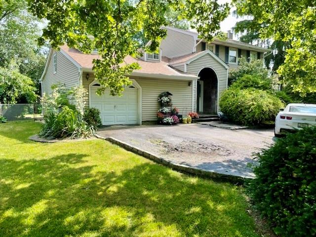 400 South Marginal Road Jericho, NY 11753 - Photo 1 of 1 a front view of a house with a yard