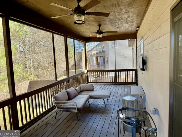 a view of a porch with wooden floor