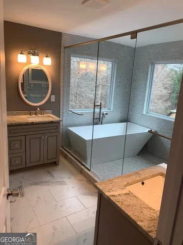 a bedroom with a bed and a mirror
