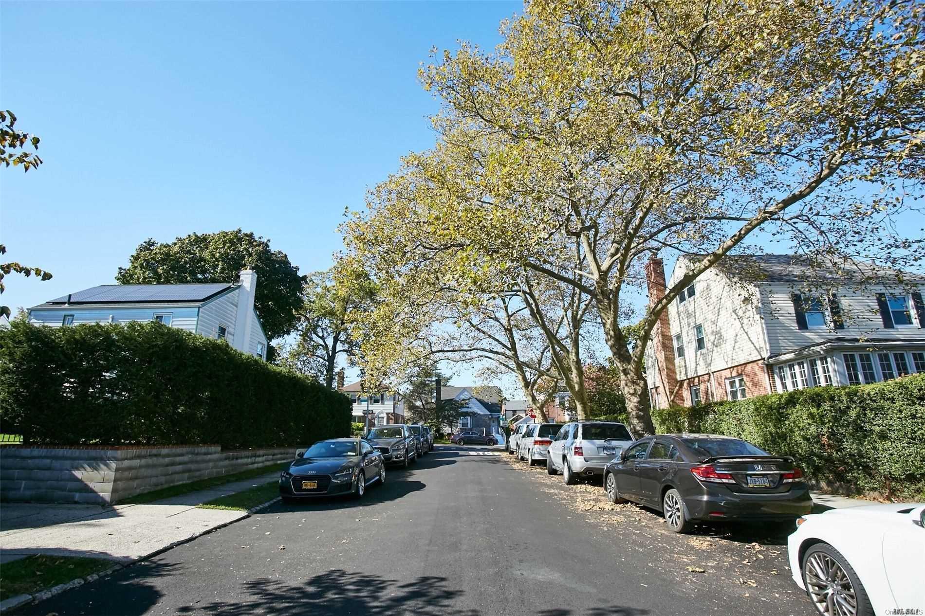176-12 77th Road Queens, NY 11366 - Photo 20 of 20 a cars parked on the side of a street
