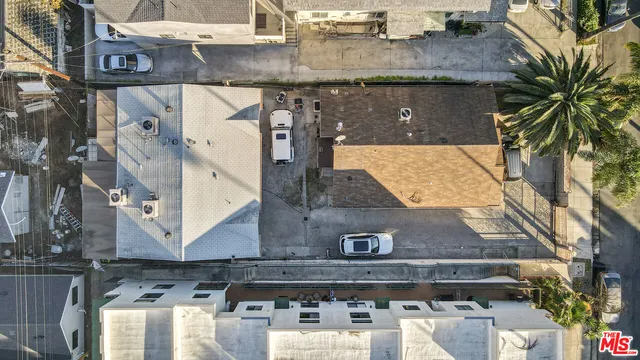 an aerial view of residential house with parking space