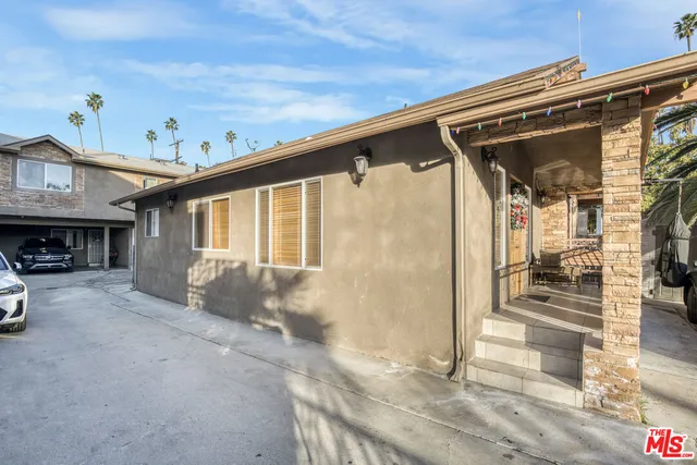 a view of car parked in front of a building