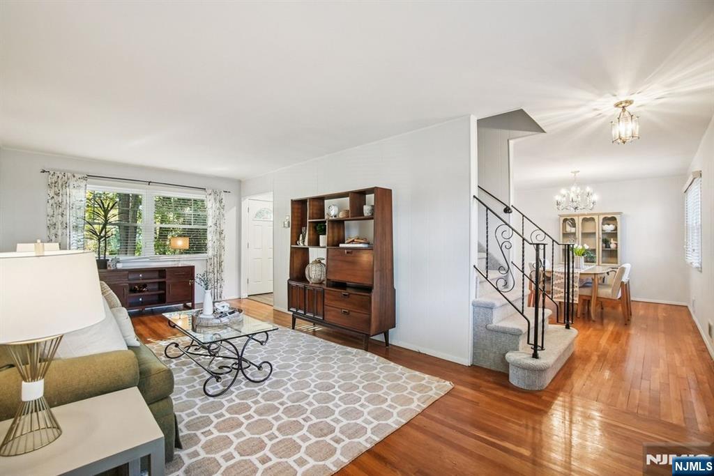 a living room with furniture windows and wooden floor