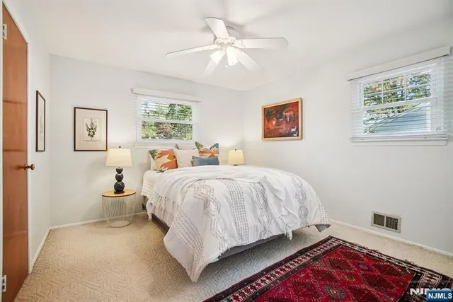 a bed room with a bed and a chandelier