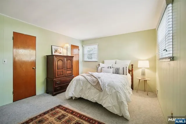 a bedroom with a bed and closet