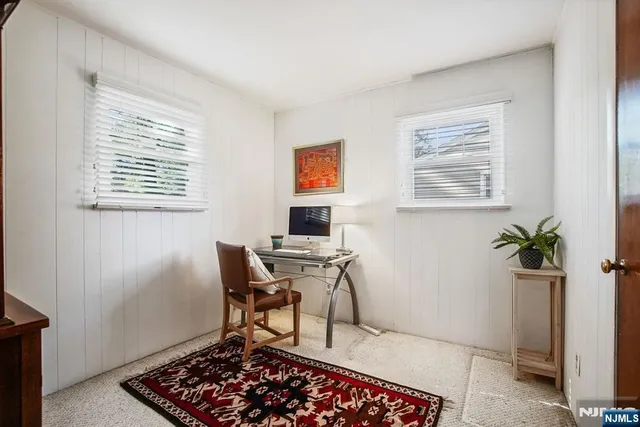 a workspace with furniture and window