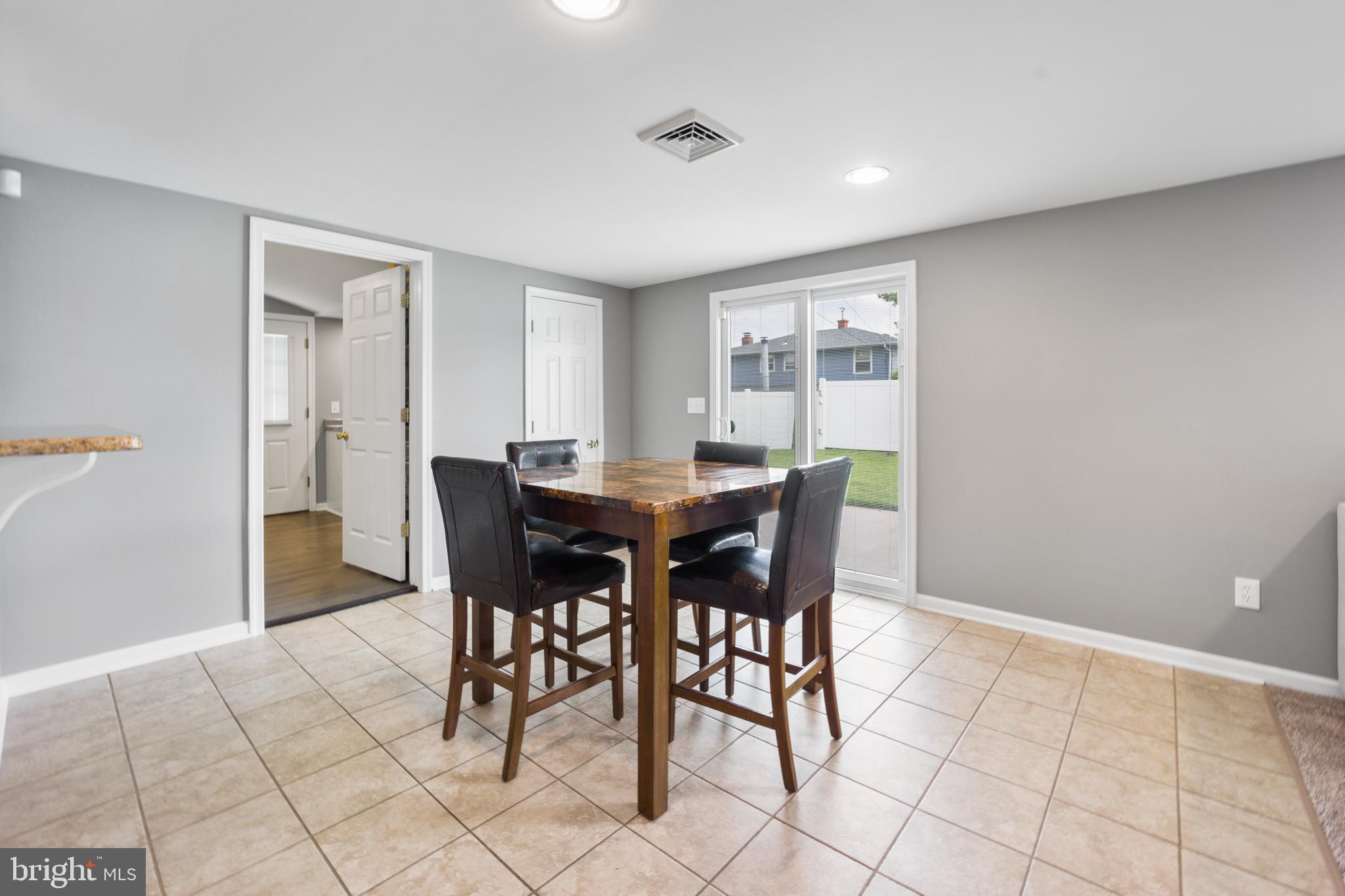 34 Tweed Road Levittown, PA 19056 - Photo 16 of 36 Dining area open leads to patio through sliders