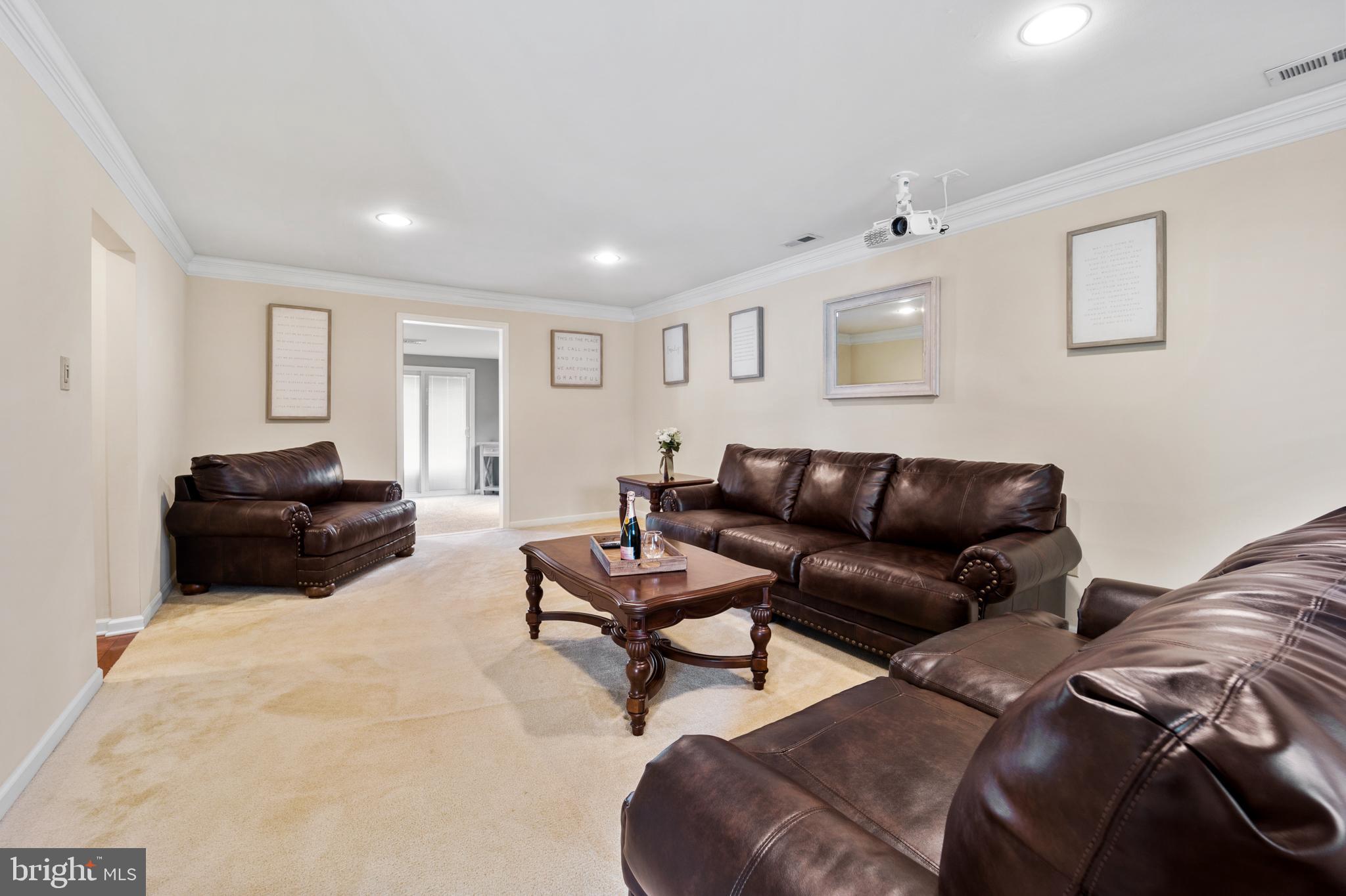34 Tweed Road Levittown, PA 19056 - Photo 3 of 36 Living Room with projector perfect for movie night