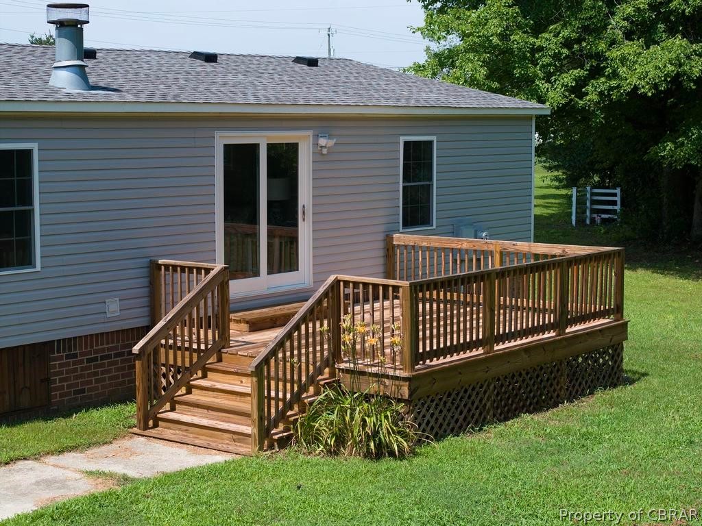1626 Buckley Hall Road Dutton, VA 23050 - Photo 19 of 37 a view of a house with a small yard and wooden fence