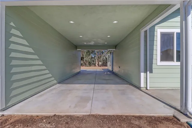 a view of a house with a yard and garage