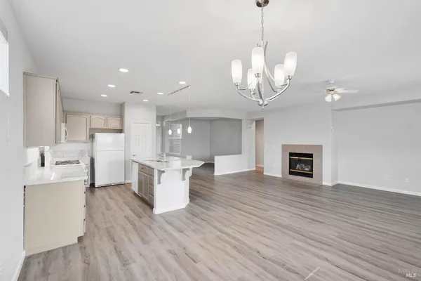 a view of a kitchen with a sink stainless steel appliances and cabinets