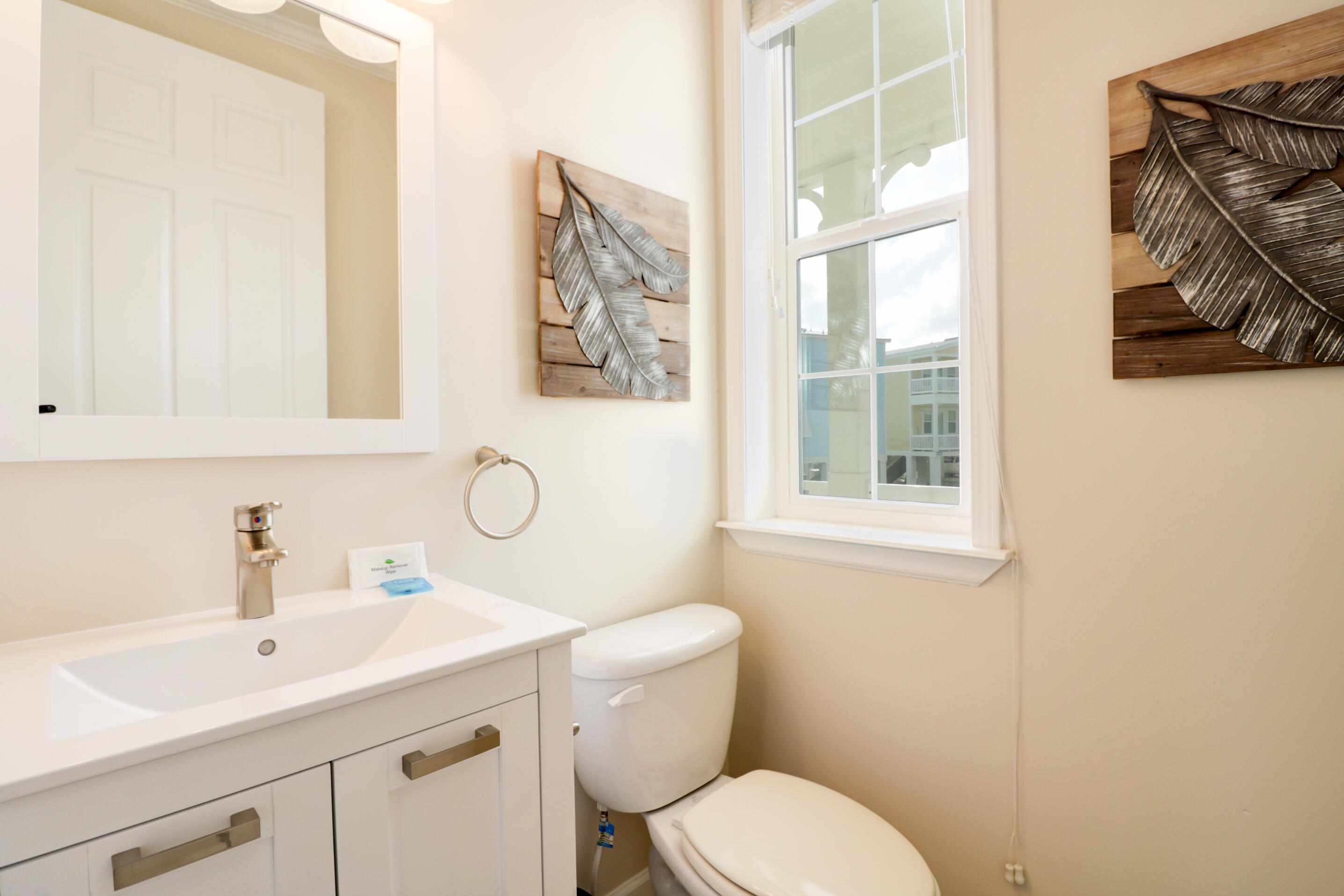 28515 Channel View Drive Summerland Key, FL 33042 - Photo 11 of 13 a bathroom with a toilet sink and mirror