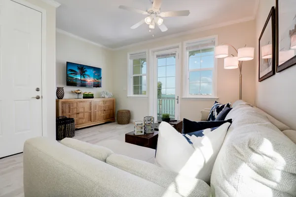 a bedroom with furniture and a flat screen tv