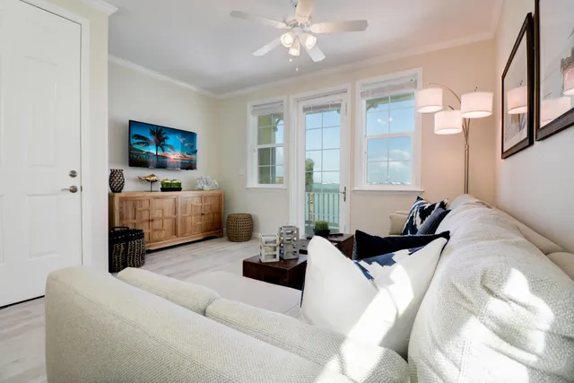a bedroom with furniture and a flat screen tv