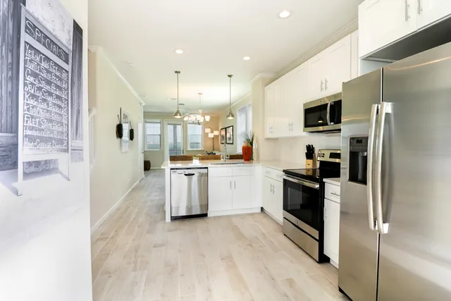 a kitchen with cabinets and stainless steel appliances